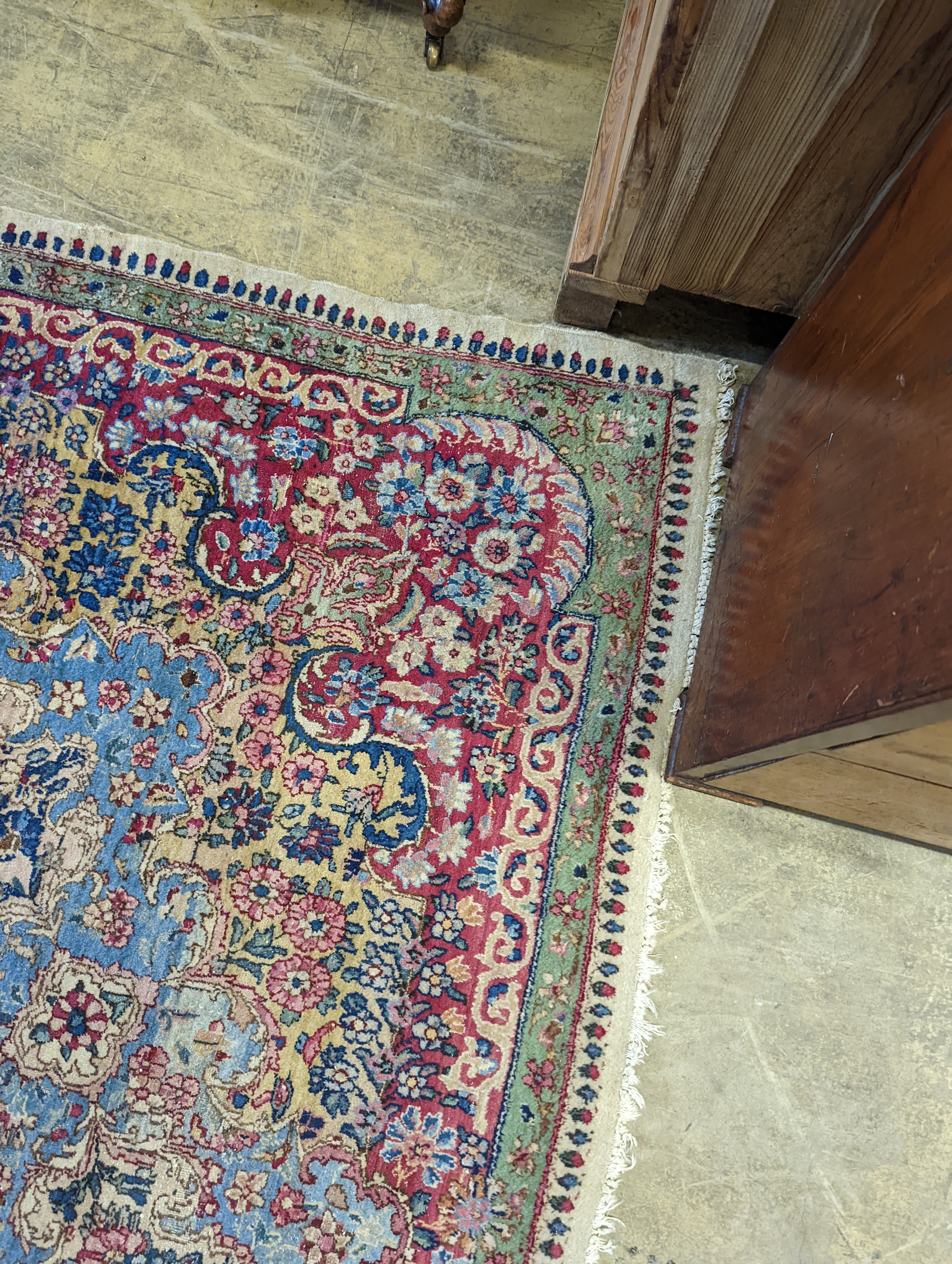 A North West Persian ivory ground carpet, 396 x 290cm